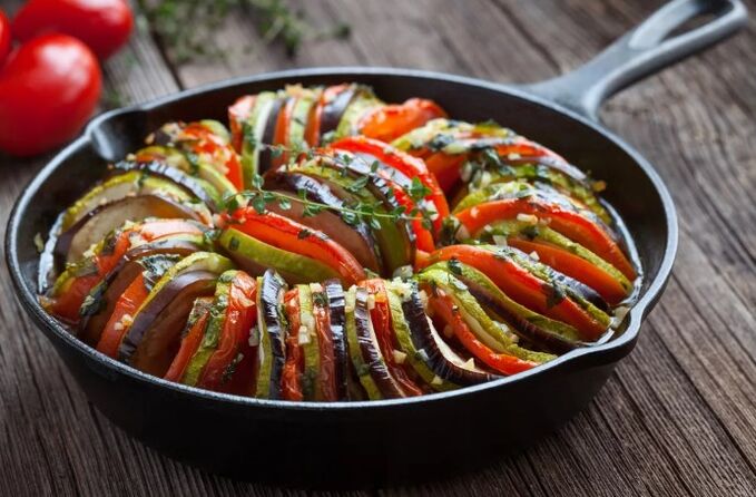 Garnish with tomatoes and zucchini